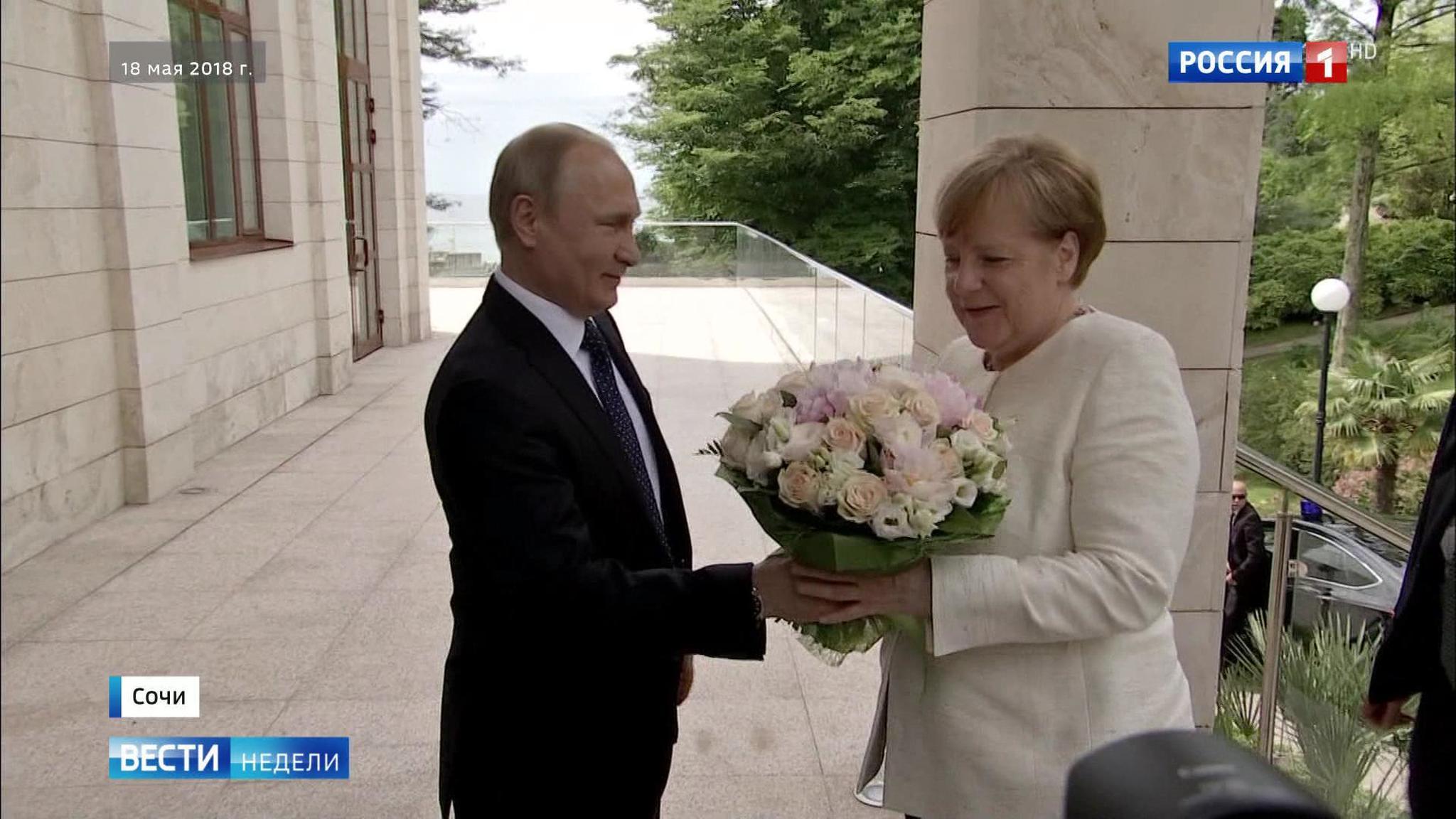 SCANDAL: German Media SHOCKED That Putin Offered Merkel Flowers Instead of Handshake