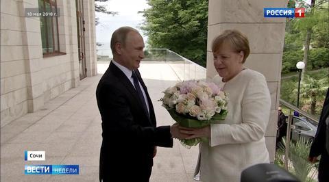 SCANDAL: German Media SHOCKED That Putin Offered Merkel Flowers Instead of Handshake