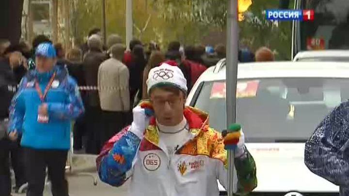 Олимпийский огонь в руках Михаила Зеленского